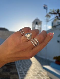 Introducing our stunning collection of silver rings, designed and handmade by the skilled artisans of Christina Christi in Greece. Each ring is crafted from basic metal, giving it a sleek and modern look that is perfect for any occasion. Each of our rings is handcrafted with a passion for quality and excellence, and is only available in our store, Christina Christi. We take pride in our designs and the attention to detail that goes into each piece. Make a statement with our versatile silver ring Handmade White Signet Ring In Sterling Silver, Handmade White Sterling Silver Signet Ring, Silver Stackable Dome Ring For Wedding, Handmade Sterling Silver Dome Ring For Anniversary, Elegant Handmade Silver Dome Ring, Handmade Silver Moonstone Ring Fine Jewelry, Silver Stackable Dome Ring For Promise, Silver Open Dome Ring Stackable, Silver Engraved Stackable Ring