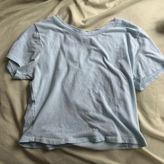 Never Worn In Great Condition. Size Medium But Fit Large Basic Washed Blue Cotton Tops, Casual Blue Summer Top, Casual Blue Tops For Summer, Light Blue Cotton T-shirt For Spring, Trendy Blue Cotton Top, Washed Blue Cotton Short Sleeve Top, Trendy Blue Cotton Shirt, Summer Light Blue Crew Neck Top, Light Blue Crew Neck Top For Summer