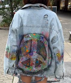 We will make this or a very similar denim jacket for you with a match of up to 85%. 100% copy is impossible when working in abstract/graffiti technique. Stylish oversized denim jacket with custom design. Features a large image of pacific symbol on the back, the design in graffiti on the front, collar and area of elbows and distressed fabric elements. Perfect for those who want to stand out! Our model is 180 sm tall and wears size S-XS Product dimensions: length 71 cm shoulder width 59 cm sleeve Multicolor Denim Outerwear With Graphic Print, Artistic Long Sleeve Denim Jacket With Graphic Print, Multicolor Graphic Print Denim Jacket, Multicolor Graphic Print Long Sleeve Denim Jacket, Artistic Denim Outerwear For Spring, Urban Denim Blue Jacket With Graphic Print, Multicolor Denim Jacket With Graphic Print, Multicolor Denim Jacket With Graphic Print For Fall, Artistic Cotton Outerwear For Streetwear