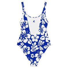 Live your best beach life in our White Hawaiian Flowers on Royal Blue One-Piece Swimsuit. With a beautiful floral print and flattering fit, this swimsuit is perfect for all shapes and sizes. The silky smooth material will have you feeling the Aloha love while you chill at the beach or pool. Now that's something to be Extremely Stoked about! • 82% Polyester, 18% Spandex • Chlorine-resistant fabric • Cheeky fit with a scoop neckline and a low scoop back • Zig-zag stitching • Double-layer front • F Hawaiian Spring Surfing Swimwear, Blue Swimwear For Surfing In Beach Season, Blue Swimwear For Surfing Beach Season, Blue Swimwear For Surfing During Beach Season, Blue Swimwear For Surfing And Beach Season, Blue Printed Swimwear For Pool, Hibiscus Print Beach Party Swimwear, Fitted Hawaiian Swimwear For Summer, Beach Party Swimwear With Hibiscus Print