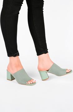 Expect tons of compliments when you step out wearing the comfortable and stylish Lorenna mule. 3" heel Slip-on Cushioned insole Open toe Mule back Block heel Textile upper/manmade sole Imported Casual Slip-on Mules With Padded Heel, Green Heels With Deep Heel Cup For Summer, Casual Summer Heels With 4-inch Heel, Chic Slip-on Block Heels For Spring, Green Open Toe Mules For Spring, Green Block Heel Mules With Padded Heel, Slip-on Mules For Spring, Summer Slip-on Heels With Block Heel, Green Spring Formal Mules