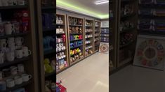 there are two pictures of the inside of a toy store with shelves full of toys