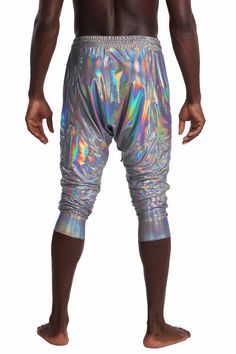 Our men's 3 quarter length shorts are the disco ball twin to the Madrid 3/4 length shorts from our sister brand, Ekoluxe. We've made them with our Chromatic spandex fabric, which is a true triple threat in the world of festival wear. Not only is it lightweight, offering a comfortable and convenient feel, but it's also breathable and quick drying, allowing you to get down on the dance floor without worrying about dripping sweat. And who could forget about the holographic quality - it's so vibrant Streetwear Shop, On The Dance Floor, Triple Threat, Long Shorts, Rave Outfits, The Dance, Disco Ball, Dance Floor, Catsuit