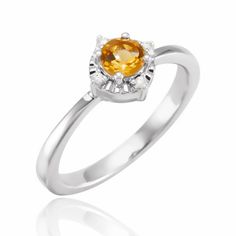 This fabulous Birthstone Brilliance Ring will let you show off your birth-month sparkle! Crafted with genuine and lab-grown birthstones, and sprinkled with natural diamond accents - this sterling silver stunner is the perfect way to add a stylish pop of color to your wardrobe! (And it's a *great* gift idea too!) Citrine Halo Ring, Colored Stone Rings, Colored Gems, Citrine Gemstone, Halo Ring, Halo Rings, White Sapphire, Birthstone Ring, Yellow Color