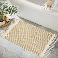 a bathroom with a bath tub and rug