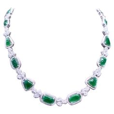 An exclusive design, so refined and glamour , a very piece of art, by Italian designer. Necklace come in 18k gold with 14 pieces of natural untreated Jades , excellent quality, of 18.68 carats, from Myanmar, in cabochon cut, in amazing green , and 991 pieces of natural diamonds of 7.66 carats, F color and VS clarity. It is a high jewels piece. Handcrafted by artisan goldsmith. Excellent manufacture and quality. Complete with AIG report. Length is about 18 inches, but it is resizable on request. Whosale price. Note: on my shipment, customers not pay taxes. Designer Necklace, Italian Designer, Drop Necklace, Myanmar, Italian Design, Exclusive Designs, Diamond Jewelry, Natural Diamonds, Jade