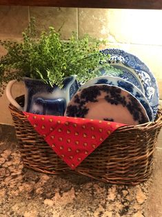 a basket filled with dishes on top of a counter