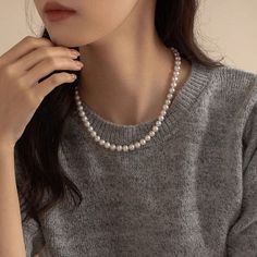 Indulge in luxury with our Natural Mabe Pearl Double Layered Necklace. This sophisticated piece is the perfect gift for her, combining elegance and beauty. The natural pearl adds a touch of exclusivity, making this necklace a truly unique and timeless addition to any collection. Material: 18K White Gold Plated Copper Stone: Cubic ZirconiaPearl: Mabe PearlNecklace 1: 6mm 17 Inch Round PearlNecklace 2: 8mm 17 Inch Round PearlThis necklace is made of 6mm and 8mm , which are strung on a silk thread. The pearls are a classic white color and have a high luster.Introducing our exquisite collection of high-end faux pearl necklaces, a perfect blend of sophistication and versatility. A clasp adorned with an infinity symbol, allowing you to wear the two necklaces together for a bold statement or sepa Elegant Pearl Bridal Necklace With Clavicle Chain, Elegant Pearl Necklace With Pendant, Elegant Long Pearl Pendant Necklace, Elegant Pearl White Beaded Necklace With Clavicle Chain, Elegant Pearl White Bridal Necklace With Clavicle Chain, Elegant Akoya Pearl Beaded Necklace As Gift, Elegant Akoya Pearl Beaded Necklace For Gift, Elegant Necklace With Pearl Drop And Round Beads, Pearl Clavicle Chain Jewelry With Round Beads