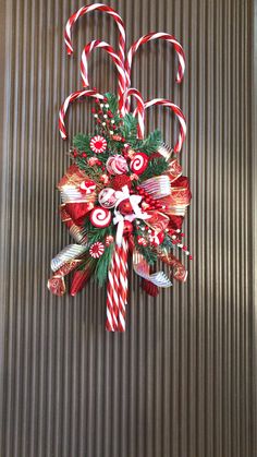 a candy cane decoration hanging on the wall