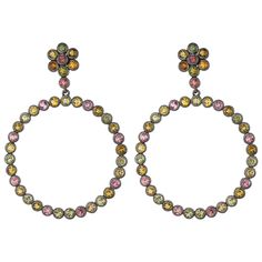 Wear a rainbow on your earlobes. These women's earrings feature 3 mm round multi tourmaline 9.50 Ct Tw arranged in a floral and a circular open space design. These earrings are crafted in genuine and Nickle free sterling silver. Post and Clutch ear backs. Please follow the Luxury Jewels storefront to view the latest collections & exclusive one of a kind pieces. Luxury Jewels is proudly rated as a Top Seller on 1stDibs with all 5 star customer reviews. JEWELRY SPECIFICATION: Approx, Metal Weight: Open Space Design, Tourmaline Earrings, Modern Earrings, Design Floral, A Rainbow, Space Design, Open Space, Multi Colored, Sterling Silver Earrings