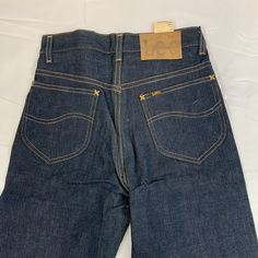 Lee denim pants Era: 1950s Size: 27" x 33" Vintage Medium Wash Tapered Leg Pants, Vintage Tapered Leg Pants In Medium Wash, Retro Straight Leg Selvedge Jeans, Vintage Straight Leg Jeans With Five Pockets, Vintage Straight Leg Cotton Jeans, Vintage Fitted Jeans With Five Pockets, Vintage Denim Blue Straight Leg Jeans, Vintage Medium Wash Bottoms With Five Pockets, Vintage Tapered Leg Denim Blue Jeans