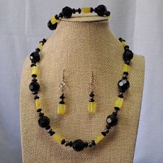 Nice 16" Choker Style Necklace Has A Hand Crafted Sterling Silver Closure With A 1 1/2" Chain Extension To Make The Necklace Longer. Nice Large Round Black Facted Beads Have A Nice Shimmer And Accent The Black Smaller Beads, Silver Metal Beads And 1/2" Rectangle Yellow Glass Beads. Matching Pierced Earrings Measure 1 1/2" And Hang From Sterling Silver French Ear Wires. Matching 7" Bracelet Has A Hand Crafted Sterling Silver Wire Closure And A 1" Extension. Should Fit Up To 8 1/2" Wrist. Nice Col Party Jewelry With Large Yellow Beads, Black Round Beads Jewelry Set As Gift, Onyx Large Beads Jewelry For Gifts, Black Round Beads Jewelry Set For Gift, Yellow Round Beads For Jewelry Making, Onyx Jewelry With Large Beads As Gift, Black Jewelry Set With Round Beads For Gift, Black Jewelry Set With Round Beads As A Gift, Elegant Yellow Jewelry With Colorful Beads