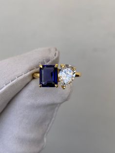 an engagement ring with two stones on it