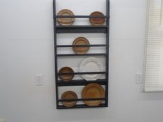 a shelf with plates on it in a room