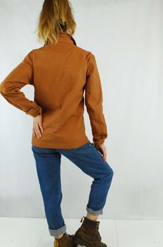 "Unisex 60s Style French Chore Jacket Duck Brown Cotton Canvas - Various Sizes Available - Made from 100% canvas cotton with tarnished antiqued bronze button rivets, buttoned cuffs and 4 useful pockets to the front. - Really easy to pair with jeans and boots or a dress. - Unisex garment. ABOUT Made to a 100% unique design specification, as designed by us at Wolf Vintage; not to be found anywhere else on the market, online or in store. Having specialised in selling vintage navy chore jackets or ' Fall Cotton Outerwear With Button Zip Fly, Brown Cotton Utility Top, Brown Collared Utility Jacket With Buttons, Brown Button-up Utility Jacket With Snap Buttons, Retro Fall Cotton Outerwear, Brown Utility Jacket With Buttons, Brown Utility Jacket With Snap Buttons For Work, Brown Long Sleeve Utility Jacket With Snap Buttons, Retro Winter Utility Jacket With Buttons