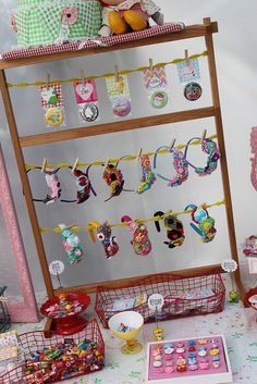 there are many items displayed on the shelf in this room, including toys and decorations