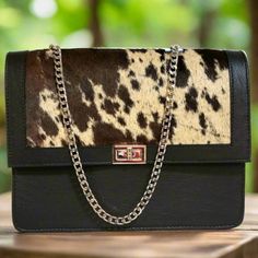 Featuring a gorgeous  design  hair on leather bag .The perfect size for fitting all of your everyday essentials , a  western touch that's hard to find in stores.  Crafted from genuine cowhide leather and best for casual and everyday wear.  height: 23cm. 9 inches width : 28cm.  11inches  base: 12cm.    4.5  inches Metal strap:125 cm  49 inches Fabric lining Interior: 1 small zippered compartment. exterior: 1 small zippered compartment.  Take advantage of the opportunity to own this amazing one-of Western Style Rectangular Travel Bag, Western Style Shoulder Bag For Everyday, Western Style Satchel Bag For Travel, Western Style Rectangular Shoulder Bag For Travel, Western Style Crossbody Shoulder Bag For Travel, Western Style Rectangular Bag With Adjustable Strap, Western Style Brown Bags For Daily Use, Western Leather Crossbody Shoulder Bag, Western Brown Satchel Shoulder Bag