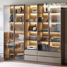 a bookcase with many books and electronics in it