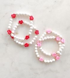 I ❤️ LOVE! The sweetest candy heart bead bracelets. Choose between pink or red hearts. Or a mix! All pieces include 14k gold or silver plating. All bracelets are FINAL SALE as these are custom orders. Please double check your bracelet size and consider the additional ½ inch increase for optimal comfort fit. CARE INSTRUCTIONS: -Avoid contact with water to improve longevity. -Roll bracelets onto your wrist to avoid over stretching. -If you are ordering a piece for a child, ALWAYS supervise while w Sweet Personalized Adjustable Jewelry, Sweet Adjustable Personalized Jewelry, Personalized Adjustable Sweet Style Jewelry, Sweet Personalized Bracelets As Gift, Cute Bracelets For Mother's Day, Personalized Sweet Bracelets As Gift, Friendship Letter Bead Charm Bracelet For Valentine's Day, Personalized Stretch Bracelet For Valentine's Day, Cute Stretch Bracelet For Mother's Day