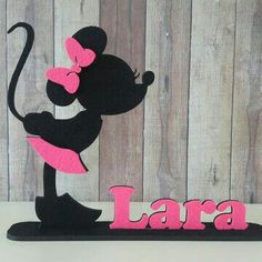 a black and pink minnie mouse with the word lara on it