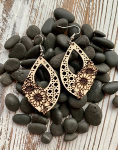 Introducing our enchanting Wood Boho Sunflower Earrings - a fusion of rustic elegance and bohemian flair. These earrings are a celebration of nature's beauty and the carefree spirit of boho style. Suspended from hypoallergenic stainless steel hooks, these Wood Boho Sunflower Earrings offer comfort and ease of wear for sensitive ears. Their lightweight construction ensures they can be worn throughout the day without any discomfort, making them a versatile accessory for casual outings or special occasions. Made from basswood plywood with a clear finish on the natural wood. Whether you're strolling through a local farmer's market, enjoying a music festival, or simply looking to express your unique style, these Wood Boho Sunflower Earrings are a versatile accessory that effortlessly complement Flower Shaped Chandelier Earrings For Gift, Teardrop Flower Earrings Gift, Teardrop Flower Pierced Earrings Gift, Adjustable Drop Flower Earrings, Flower Earrings For Mother's Day, Bohemian Earrings For Mother's Day Gift, Wood Dangle Earrings, Sunflower Earrings, Laser Cut Wood