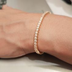 "D I A M O N D ∙ T E N N I S ∙ B R A C E L E T ∙ W O M E N ∙ 18K gold plated sterling silver.  Best gift for her. Gift for wife. Valentine's day gift idea.  ✓Gold tennis bracelet perfect for spoiling yourself or gifting. ✓ Diamond tennis bracelet it will be the right choice for your daily use. Style: Minimalist jewelry * Gold chain bracelet * Diamond tennis * Birthday gift * Bracelet  women * CZ tennis bracelet * Birthday gifts * P R O D U C T - D E S C R I P T I O N  ✓Our 18k gold plated jewelr Everyday Gold Plated Tennis Bracelet, Rose Gold Tennis Bracelet For Anniversary, Adjustable Gold Tennis Bracelet In Fine Jewelry, Anniversary Fine Jewelry Rose Gold Tennis Bracelet, Minimalist Gold Bracelet With Diamond Cut For Anniversary, Fine Jewelry White Gold Tennis Bracelet Gift, Gift White Gold Diamond Bracelet With Prong Setting, White Gold Diamond Bracelet With Prong Setting Gift, Elegant Hypoallergenic Yellow Gold Bracelets