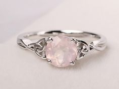 Welcome to my shop, you can find many beautiful gemstone jewelry here, and you also can ask for customized service. Main Stone: Natural pink quartz , round cut 7 mm Accent Stones: None Metal: 925 sterling silver plated with rhodium so as to protect the ring from tarnish and keep it shinning. I also can provide metal options such as 14k solid yellow/white/rose gold Setting: bezel setting more rings: https://www.etsy.com/shop/XCjewelryStudio?ref=hdr_shop_menu It's quite comfortable for wearing and Rose Quartz Wedding Rings, Rose Quartz Engagement Ring Silver, Rose Quartz Wedding Ring Silver, Round Rose Quartz Promise Ring, Rose Quartz Promise Ring, Engagement Rings Celtic, Pink Stone Engagement Rings, Rose Quartz Heart Ring, Silver Rose Quartz Crystal Ring Gift