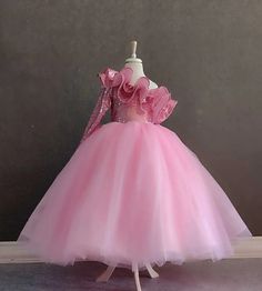 Make your little princess's dreams come true with our Pink One Shoulder Princess Ball Gown! This custom-designed dress is perfect for Barbie-themed parties or any special occasion where she wants to shine like royalty. The puffy design adds volume and flair, ensuring she'll feel like the belle of the ball. Crafted with attention to detail and made from high-quality materials, this dress is not only stylish but also comfortable for all-day wear. Whether it's her birthday or another special event, she'll love twirling and dancing in this enchanting princess dress. Order now and let her imagination soar! Pink One Shoulder Princess Ball Gown- Custom Design Puffy Dress for Barbie Parties- Princess Dress for Girls Birthdays and Special Occasions Kids Ball Gowns Princesses, Barbie Gown For Kids, Kids Birthday Dress For Girl, Kids Gown Princesses, Barbie Frocks For Kids, Pink Princess Dress For Kids, Princess Dresses Kids Ball Gowns, Barbie Princess Dress, Kids Ball Gowns