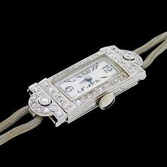 Anniversary Diamond Chronometer Watch, Vintage Diamond Watch With Rectangular Dial, Art Deco Rectangular Watch With Diamond Hour Markers, Art Deco Rectangular Watch With Diamond Markers, Luxury Diamond Watch With 17 Jewels As Gift, Vintage Rectangular Diamond Watch With Diamond Hour Markers, Art Deco Evening Watch With Diamond Hour Markers, Art Deco Platinum Evening Watches, Platinum Art Deco Evening Watches