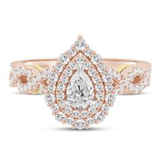 a rose gold engagement ring with an oval cut diamond surrounded by small round brilliant diamonds