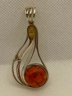 "This is a vintage, genuine, gorgeous, rare Jay King multi stone and sterling silver pendant with genuine yellow citrine and orange sponge coral. The pendant is large, measuring about 2 1/3\" by 1 1/8\". The bale opening is about 1/2\" in diameter. The orange sponge coral is round-cut and set in a polished sterling silver bezel. It measures about 5/8\" in diameter. The teardrop-cut yellow citrine is also set in a polished sterling silver bezel and measures about 3/8\" by 1/4\" at the widest poin Unique Orange Sterling Silver Jewelry, Orange Gemstone Jewelry With Round Pendant, Sterling Silver Pendant Necklace In Orange, Orange Sterling Silver Round Pendant Jewelry, Orange Cabochon Sterling Silver Jewelry, Sponge Coral, Yellow Citrine, Jewelry Christmas, Desert Rose