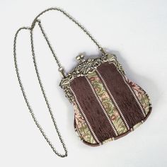 Introducing our captivating collection of Chatelaine purses, inspired by the elegance of the Victorian era.Available in three sizes—Large, Medium, and Small—these purses offer versatility and style. The Large and Medium sizes can be used as both a clutch and a crossbody purse, as we provide two chains for each size: 50" and 13" in length. This allows you to effortlessly switch between crossbody and clutch styles.Let's focus on the Chatelaine Large Crossbody Purse:With a frame width of 6.25" and a height of 8", this purse comfortably holds larger items like the iPhone 14 Pro Max and a passport. It features a small slip pocket for cards or small essentials, and the 1.5" bottom depth provides ample space for your necessities.The Large Crossbody Purse includes two chains, each with brass hooks Vintage Formal Shoulder Bag With Mobile Phone Bag, Vintage Clutch For Daily Use With Mobile Phone Bag, Elegant Clutch Coin Purse For Travel, Elegant Rectangular Travel Coin Purse, Elegant Crossbody Coin Purse For Travel, Elegant Crossbody Coin Purse For Everyday Use, Elegant Crossbody Coin Purse For Daily Use, Vintage Mobile Phone Shoulder Bag Gift, Elegant Crossbody Coin Purse