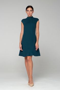 "Simple but elegant asymmetrical green cocktail dress in asian style is easy to wear for any party! - Chinese (modern cheongsam) style - Stand collar (mandarin) - Short cap sleeves - Skater pleated skirt - A-Line fitted silhouette - Hidden zipper on the back - Above the knee length (midi) Fiber: 40% viscose, 55% polyester, 5% elastan Color: green For size S: length- 34\" (86 cm) Our model wears size S (US 8) and is 171cm/5'6\" tall. You may feel free choosing the size. Just send us your measurem Elegant Fitted Asymmetrical A-line Dress, Elegant Asymmetrical Dress For Fall Workwear, Green Fitted Asymmetrical Dress For Cocktail, Flattering Cut Knee-length Dress For Party, Flattering Knee-length Party Dress, Flattering Cut Knee-length Party Dress, Elegant Green Fit And Flare Dress, Party Fit And Flare Midi Dress With Flattering Cut, Formal Sleeveless Dress With Asymmetrical Hem For Spring