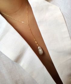 Classy, timeless and goes with everything! Each pearl is hand-selected and unique. Comes wrapped ready to gift! --- 14k gold filled OR sterling silver chain, hardware + clasp AAA quality freshwater baroque pearl 18 + 2.5'' drop + pearl pendant -- --PROCESSING-- Item is custom made to order, please allow 4 - 12 business days to ship. Comes wrapped ready to gift! --SHIPPING-- All orders are shipped via USPS first class mail. --QUALITY IS EVERYTHING-- You're investing in a piece that will last! Gol Classic Gold Lariat Necklace Perfect For Gifts, Elegant Jewelry With Baroque Pearl And Paperclip Chain, Elegant Jewelry With Rectangular Pendant Cable Chain, Elegant Jewelry With Cable Chain And Rectangular Pendant, Baroque Pearl Paperclip Chain Jewelry Gift, Elegant Oblong Necklace With Adjustable Chain, Elegant 14k Gold Filled Rectangular Necklace, Rectangular Pearl Drop Jewelry For Gifts, Elegant Lariat Necklace With Paperclip Chain