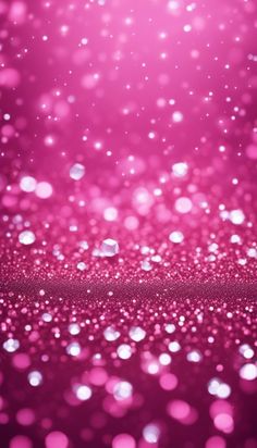 pink blurry background with lots of small bubbles on the bottom and one light in the middle