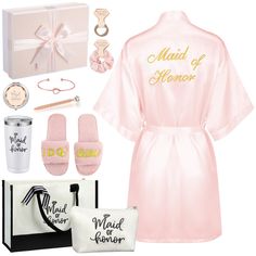 the bride's robes and accessories are laid out in front of a gift bag