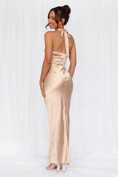 Length from neck to hem of size S: 142cm. 
 Chest: 36cm, Waist: 34cm, across front only of size S. 
 Maxi dress. 
 Lined. 
 Model is a standard XS and is wearing size XS. 
 True to size. 
 Non-stretch. 
 Luxurious satin. 
 Halter tie neckline. 
 High neck. 
 Elastic back. 
 Vent extension. 
 Straight, flowy silhouette. 
 Zipper with hook eye closure.  
 Cold hand wash only. 
 Polyester. 
 This material is very delicate. Please handle with care. 
 Please Note: This product is a Exclusive.  
 
 St Fitted Satin Dress With Tie Back, Fitted Halter Neck Dress For Dress Down Occasions, Fitted Halter Neck Dress For Casual Wear, Tie Back Midi Evening Dress, Midi Length Tie Back Dress For Evening, Tie Back Midi Dress For Evening, Formal Fitted Long Halter Dress, Fitted Halter Neck Maxi Dress For Dress Down, Fitted Halter Neck Maxi Dress For Casual Occasions