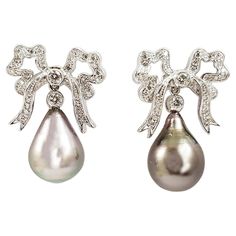 South Sea Pearl with Diamond 0.67 carat Earrings set in 18 Karat White Gold Settings Width: 1.8 cm Length: 2.6 cm Total Weight: 11.93 grams "We first opened doors in 1980 when it was then situated in the vicinity of the Victory Monument; a small and modest storefront with a couple of counters. From its humble beginnings to where it stands today, our company has proven its abilities as a jeweler. Since the beginning, we have been supplying fine quality pieces to dealers, wholesalers and customers Luxury White Gold Art Deco Earrings, Luxury Pear-shaped Diamond Evening Earrings, Luxury Pear-shaped Diamond Earrings For Evening, Pear-shaped Evening Diamond Earrings, Luxury Platinum Diamond Earrings Hallmarked, Elegant Platinum Diamond Earrings Gift, Pear-shaped Diamond Earrings For Formal Events, Luxury Platinum Pearl Earrings For Formal Occasions, Luxury Pear-shaped Earrings For Formal Occasions