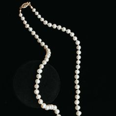 A modern take on a classic staple featuring lustrous white pearls. These luxurious pearl necklaces are hand-knotted on silk, accented with an antique 14k gold basket clasp. The necklace length makes the pearls easy to wear and layer with other pieces. Hand-strung on silk Measures approx. 17" long Finished with an antique 14k clasp Custom lengths available Because our pieces are all made entirely by hand we can offer a huge array of customization! If you have inquiries about custom sizing, stone Luxury Long Pearl Necklace With Charm, Pearl White Single Strand Necklace With Round Beads, Single Strand Pearl Necklaces With Round Beads, Classic Long Pearl White Necklace, Elegant Akoya Pearl Beaded Necklace, Gold Jewelry With Hand-knotted Round Beads, Elegant Long Single Strand Pearl Necklace, Luxury Pearl Necklaces With Round Beads, Classic Yellow Gold Beaded Necklaces