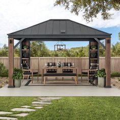 a gazebo sitting on top of a lush green field