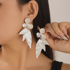 Add elegance with these silver drop earrings featuring delicate leaf and flower designs. Their polished finish and graceful dangle make them a perfect accessory for a refined look Club Events, Piercing Earrings, Lily Bloom, Shape Geometric, Leisure Fashion, Unique Accessories, Tassel Drop Earrings, Romantic Flowers, Flower Petal