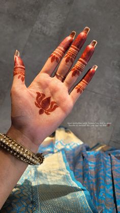 a woman's hand with hendix painted on it