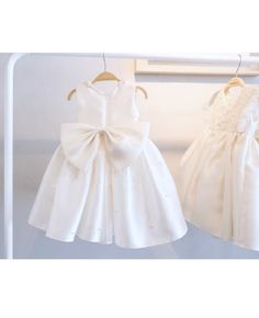 Shop designer baby collar ivory flower girl dress with pearls big bow in back online. Super cute styles with couture high quality. Pro since 2009. Bridal Party Color Schemes, Designer Flower Girl Dresses, Flower Girl Dresses Vintage, Bridal Parties Colors, Ivory Flower Girl Dress, Delicate Gown, Dress With Pearls, Girls Designer Dresses, Ivory Flower Girl