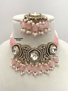 Premium quality Kundan pearls Choker comes with gorgeous Earrings and Tikka/ Indian Jewelry/Unique Polki and Kundan Jewelry/pink   All items are shipped from Brampton, Ontario, Canada. If you need your item by a certain day, please reach out to us for express delivery option before placing the order so that we can update the shipping for you. Standard shipping/delivery timeline Below are the delivery timeline estimates. We dispatch all orders by the next business day. ---> USA delivery timeline Pink Bridal Sets For Party And Festive Occasions, Pink Bridal Sets For Party, Festive Pink Bridal Sets For Party, Pink Bridal Sets For Festive Occasion Gift, Pink Bridal Sets For Festive Gift, Pink Bridal Sets For Festive Occasion, Festive Pink Bridal Sets As A Gift, Pink Bridal Sets For Festive Celebration, Pink Round Kundan Necklace For Diwali