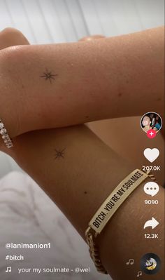 a woman's arm with a star tattoo on it and the words, i love you