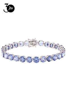 Pre-Owned Bella Luce�� Esotica��� tanzanite simulant 37.47ctw round, rhodium over sterling silver tennis bracelet. Measures approximately 7.25-8.00" L x 0.19" W and has a hidden box clasp closure..  This product may be a customer return, vendor sample, or on-air display and is not in its originally manufactured condition.  It may not be new.  In some instances, these items are repackaged by JTV. Silver Tennis Bracelet, Cubic Zirconia Bracelet, Bracelet Box, Moissanite Necklace, Yellow Gemstones, Diamond Alternatives, Box Clasp, Cubic Zirconia Earrings, Cubic Zirconia Rings