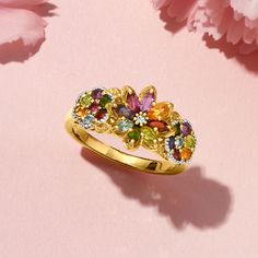 Ross-Simons - 1.34ct t. w. Multi-Gemstone Floral Ring in 18kt Yellow Gold Over Sterling. Size 9. Shimmering with a beautiful rainbow of sparkle, this floral statement ring presents a stunning mix of 1.34 ct. tot. gem wt. round and marquise amethyst, chrome diopside, garnet, peridot, rhodolite garnet, Swiss blue topaz, citrine and iolite. Crafted in polished 18kt yellow gold over sterling silver with milgrain details. 3/8" wide. Multi-gemstone floral ring. Garnet birthstones are the perfect gift Flower Gemstone Ring, Rainbow Engagement Ring, Flower Ring Design, Jewelry Redesign, Gem Engagement Rings, Pretty Engagement Rings, Dainty Gold Jewelry, Peridot Color, Garnet Birthstone