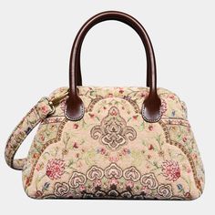 Embrace timeless elegance with our exquisite Victorian Carpet Satchel, a masterpiece meticulously crafted from thick chenille carpet for a luxurious and sophisticated touch. Designed with unique construction, this handbag stands on its own, effortlessly blending style with functionality. Crafted for enduring quality, the bag features genuine leather handles and a sturdy, heavy cotton canvas lining. Each purchase includes a detachable and adjustable shoulder strap, generously measuring 55 inches in length. The strap is skillfully crafted from the same chenille as the bag, and adorned with high-quality bronze hardware for added charm. Perfectly sized for everyday use, our handbag offers ample space to carry your essentials with ease. Stay organized with one zippered pocket, precisely sized a Formal Tapestry Bags, Luxury Embroidered Cream Bag, Formal Embroidered Tapestry Bag, Luxury Tapestry Bags For Formal Occasions, Elegant Tapestry Bags With Detachable Handle, Elegant Rectangular Tapestry Shoulder Bag, Elegant Tapestry Shoulder Bag With Detachable Handle, Elegant Embroidered Shoulder Bag For Travel, Beige Tapestry Top Handle Shoulder Bag