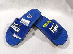 For a comfortable athletic sandal he/she can simply slip-on and off, give him the Nike Kawa Slide! These slides feature durable synthetic uppers, padded fabric lining for comfort, and textured footbed for a massaging feel with every step. Pair the Nike Kawa Slide with his athletic wear for a stylish sporty look! FEATURES: Flexible, lightweight traction outsole Injected Phylon midsole with a textured footbed for a massaging feel Open toe Simple slip-on design Padded, silky soft fabric strap lining Durable synthetic upper Style 819352-404 NOTE:  All items listed in our store are 100% authentic/original, they come from their own brand stores and other Dept Stores.  Our store is located in the United States, therefore all clothing and shoes are based in US sizes. If you need size conversion or Athletic Sandals, Nike Boy, Fabric Strap, Slides Shoes, Sporty Look, Athletic Wear, Boys Shoes, Slide Sandals, Kids Boys