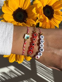 Three Bracelets for March with different central charms that will protect you from the spring's sun. The first bracelet has a tiny evil eye in rectangular shape, the middle bracelet a raw of tiny flowers and the last one is a bracelet with tiny letters that write ''LOVE MARCH'' and completes this unique set. You can wear them together or separetely as well. Find them only at Christina Christi Store. 👉 My Mens Bracelets Collection: https://etsy.me/2UunKla 👉 Express Shipping: https://etsy.me/3ik Handmade Red Bracelets For Everyday, Red Personalized Spiritual Bracelets, Personalized Red Spiritual Bracelets, Personalized Spiritual Red Bracelets, White Beaded Friendship Bracelets With Charms, Red Bohemian Bracelets With Letter Beads, Bohemian Red Bracelets With Letter Beads, Handmade White Good Luck Bracelets, Red Beaded Bracelets With Charms